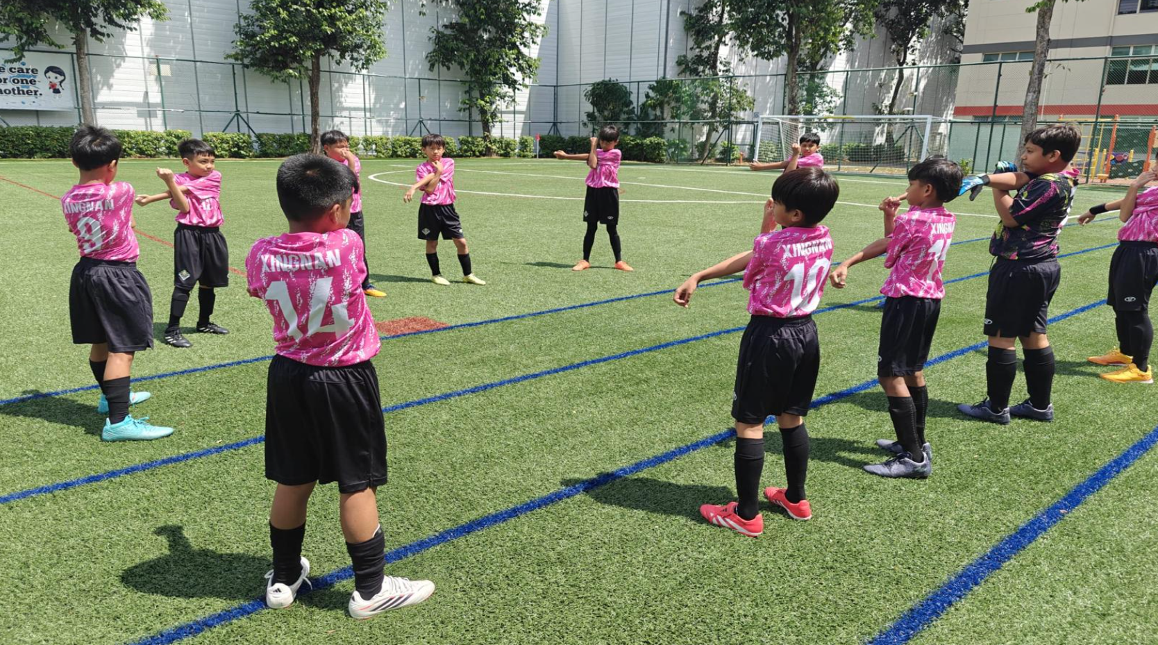Our soccer boys doing their warm up together.